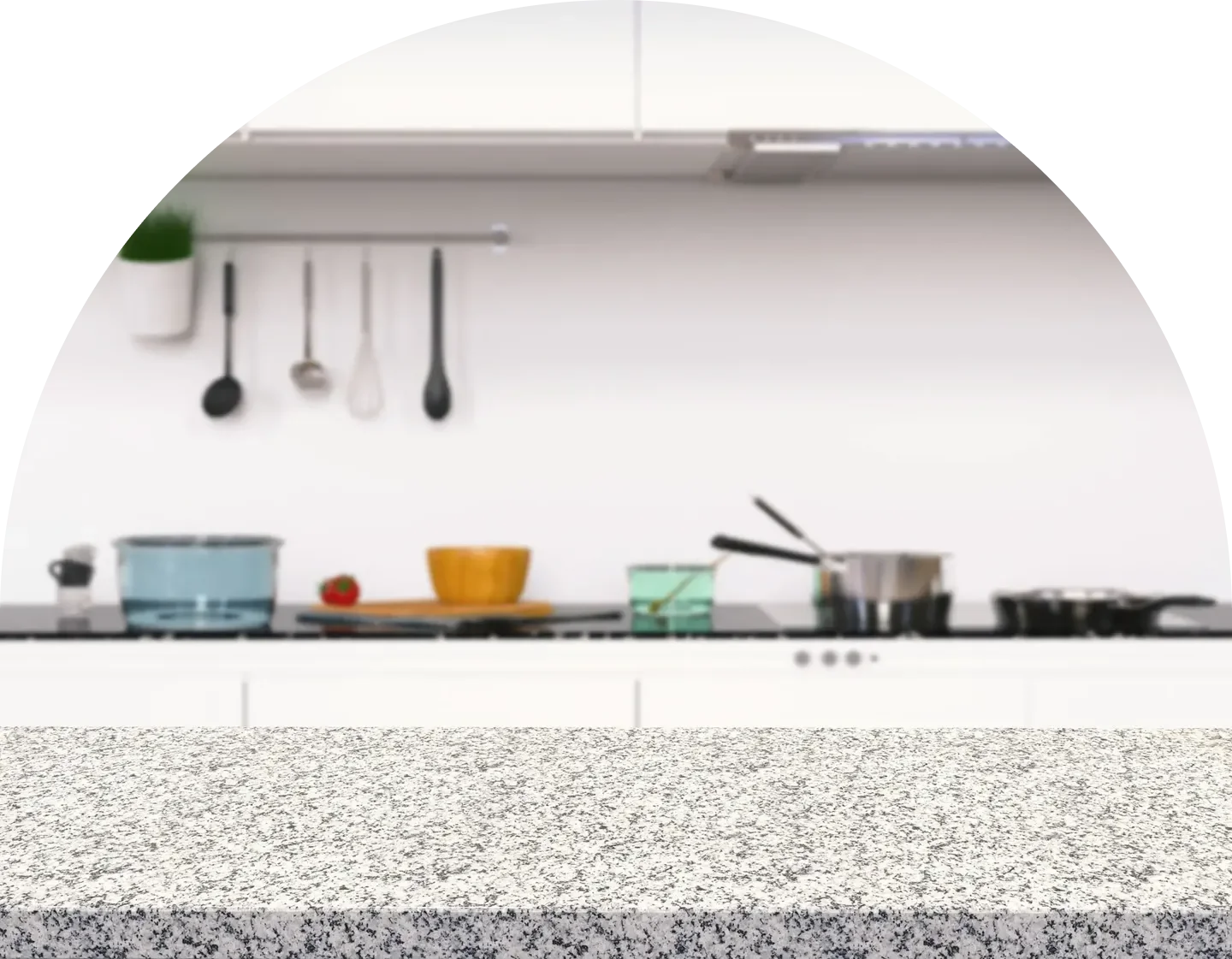 Modern kitchen countertop with cooking utensils, pots, and a stove in a clean, minimalistic setting.